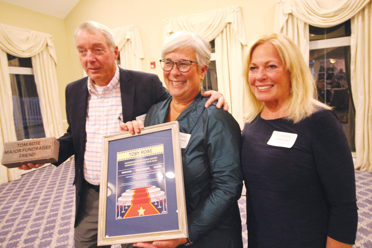 NEW AWARD: EBC Center board chair Martha Machnik, flanked by Toby Rose and Judith Earle, announces the newly established Toby Rose Humanitarian Award at Thursday night’s event.